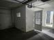 Spacious unfinished basement with a door leading to another room at 2083 Envoy Ct, Clearwater, FL 33764
