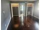 Spacious bedroom with hardwood floors and closet storage space at 2083 Envoy Ct, Clearwater, FL 33764