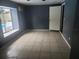 This bedroom features tiled floors, a window overlooking the pool, and an AC unit at 2083 Envoy Ct, Clearwater, FL 33764