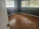 Bedroom with hardwood floor and natural light at 2083 Envoy Ct, Clearwater, FL 33764