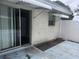 Exterior shot showing a sliding glass door and the side of the house at 2083 Envoy Ct, Clearwater, FL 33764