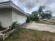 Garage with driveway and landscaping at 2083 Envoy Ct, Clearwater, FL 33764