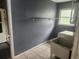 This laundry room includes a utility sink, washing machine, and a shelf at 2083 Envoy Ct, Clearwater, FL 33764