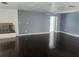 Spacious living room with hardwood floors and a fireplace, perfect for entertaining at 2083 Envoy Ct, Clearwater, FL 33764
