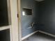 This room includes wood trim and bare floors at 2083 Envoy Ct, Clearwater, FL 33764