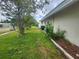 Side yard with landscaping at 2083 Envoy Ct, Clearwater, FL 33764