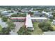 Aerial view of complex featuring multiple residential buildings, landscaping, and parking areas at 2402 Ecuadorian Way # 40, Clearwater, FL 33763