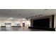Expansive auditorium showcasing a large stage with curtains, ideal for presentations and performances at 2402 Ecuadorian Way # 40, Clearwater, FL 33763