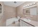 Bathroom with a tub, vanity, and tile flooring at 2402 Ecuadorian Way # 40, Clearwater, FL 33763