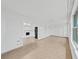 Bright and airy living room space with tile flooring, a ceiling fan, and access to the kitchen at 2402 Ecuadorian Way # 40, Clearwater, FL 33763