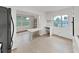 Bright living area with built-in shelving and an open layout to the kitchen at 2402 Ecuadorian Way # 40, Clearwater, FL 33763
