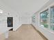 Open living space with bright windows and an adjacent kitchen area at 2402 Ecuadorian Way # 40, Clearwater, FL 33763