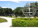 Community park offering tranquil space with green grass, benches, and an interesting decorative globe at 2402 Ecuadorian Way # 40, Clearwater, FL 33763