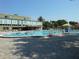 Large community pool with lounge chairs, offering a refreshing amenity for residents to enjoy at 2402 Ecuadorian Way # 40, Clearwater, FL 33763