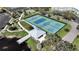 Aerial view of community tennis courts, picturesque gazebo, and lush green landscaping at 2402 Ecuadorian Way # 40, Clearwater, FL 33763