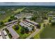 An aerial view of the condo and surrounding landscaping with mature trees near the lake at 306 Martha Ln # 42, Oldsmar, FL 34677