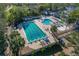 Stunning aerial view of a pool and recreation area with seating and mature landscaping at 306 Martha Ln # 42, Oldsmar, FL 34677