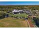 Panoramic aerial view of the club house with golf course and lush landscaping at 306 Martha Ln # 42, Oldsmar, FL 34677