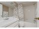 Bathroom with bath tub, white cabinets and flooring at 306 Martha Ln # 42, Oldsmar, FL 34677