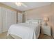 Bedroom with ceiling fan and double door closets at 306 Martha Ln # 42, Oldsmar, FL 34677