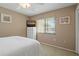 Bright bedroom with wall mounted TV and window at 306 Martha Ln # 42, Oldsmar, FL 34677