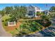Scenic view of the club entrance with manicured lawn and building in the background at 306 Martha Ln # 42, Oldsmar, FL 34677