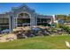 An exterior view of an outdoor seating area with blue and tan umbrellas overlooking the golf course at 306 Martha Ln # 42, Oldsmar, FL 34677