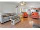 Cozy living room featuring wood floors, comfortable seating, and an open floor plan at 306 Martha Ln # 42, Oldsmar, FL 34677