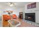 Inviting living room showcases a fireplace, ample seating, and wood flooring at 306 Martha Ln # 42, Oldsmar, FL 34677