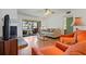 Living room boasts a fireplace, comfortable seating, and access to a screened balcony at 306 Martha Ln # 42, Oldsmar, FL 34677