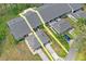 Aerial view of a charming neighborhood with well-manicured lawns and mature palm trees, outlined in yellow at 3274 Lori Ln # 2, New Port Richey, FL 34655