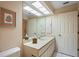 Bathroom with a double sink vanity, a large mirror, and great lighting, offering a functional space at 3274 Lori Ln # 2, New Port Richey, FL 34655