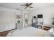 Bedroom showcasing ample storage, a desk, and neutral tones for a comfortable and organized living space at 3274 Lori Ln # 2, New Port Richey, FL 34655