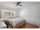Cozy bedroom with natural light, hardwood floors, a ceiling fan, and a neutral color scheme at 3274 Lori Ln # 2, New Port Richey, FL 34655