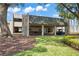 Elegant clubhouse entrance with covered parking and manicured landscaping at 3274 Lori Ln # 2, New Port Richey, FL 34655