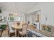 Inviting dining area with adjacent piano and serving buffet with views to the kitchen and hallway at 3274 Lori Ln # 2, New Port Richey, FL 34655