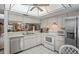 Bright, modern kitchen with stainless steel appliances and ample counter space, open to the dining area at 3274 Lori Ln # 2, New Port Richey, FL 34655