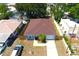 Overhead view of a charming house showing the roof, trees, fenced yard, and concrete driveway at 3315 W Saint John St, Tampa, FL 33607