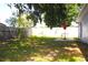 Spacious fenced backyard with a patio area, perfect for relaxing and enjoying the outdoors at 3315 W Saint John St, Tampa, FL 33607