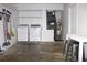 Utility area with laundry appliances, hot water heater, HVAC system and a table for folding at 3315 W Saint John St, Tampa, FL 33607