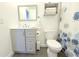 A bright and clean bathroom features a gray vanity and an adjacent toilet with gray tile floors at 3315 W Saint John St, Tampa, FL 33607