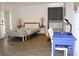 Nicely decorated bedroom featuring two beds, a desk and chair, and matching wooden nightstands and lamps at 3315 W Saint John St, Tampa, FL 33607