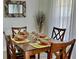 Formal dining table setting with decorative plates and glasses at 3315 W Saint John St, Tampa, FL 33607