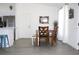 Inviting dining area with hardwood floors and a decorative mirror at 3315 W Saint John St, Tampa, FL 33607