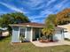 Cozy single-story home with a well-manicured lawn, attached garage, and a welcoming front patio area at 3315 W Saint John St, Tampa, FL 33607
