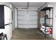 Garage with storage cabinets, shelving and an automatic door at 3315 W Saint John St, Tampa, FL 33607