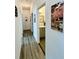 Hallway view leading to bathroom with gray vanity and updated fixtures at 3315 W Saint John St, Tampa, FL 33607