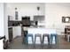 Well-equipped kitchen with stainless steel appliances and seating at the island at 3315 W Saint John St, Tampa, FL 33607