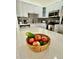 Bright kitchen featuring white cabinetry, stainless steel appliances and ample counter space with fruit basket at 3315 W Saint John St, Tampa, FL 33607