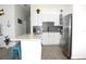 Beautiful kitchen with a quartz countertop island and white cabinets at 3315 W Saint John St, Tampa, FL 33607